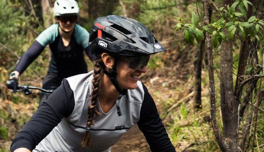 a woman wearing a mountain bike helmet