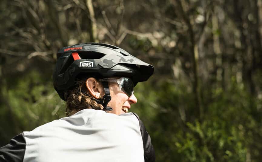 a close up mage of a woman mountain biking