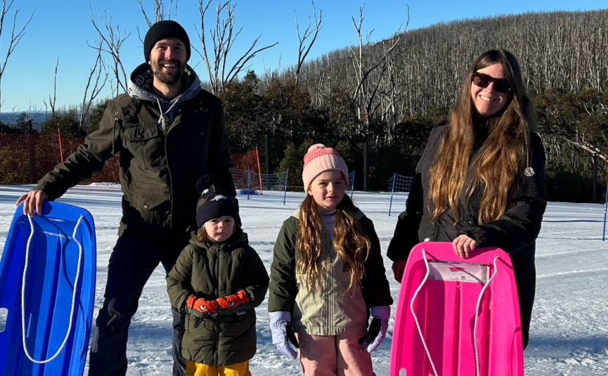 family with toboggans