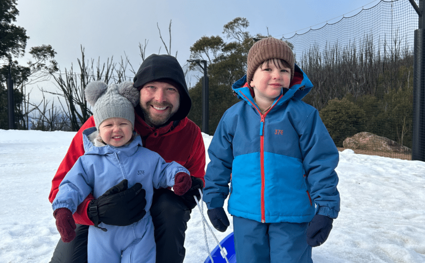 family tobogganing at lake mountain alpine resort