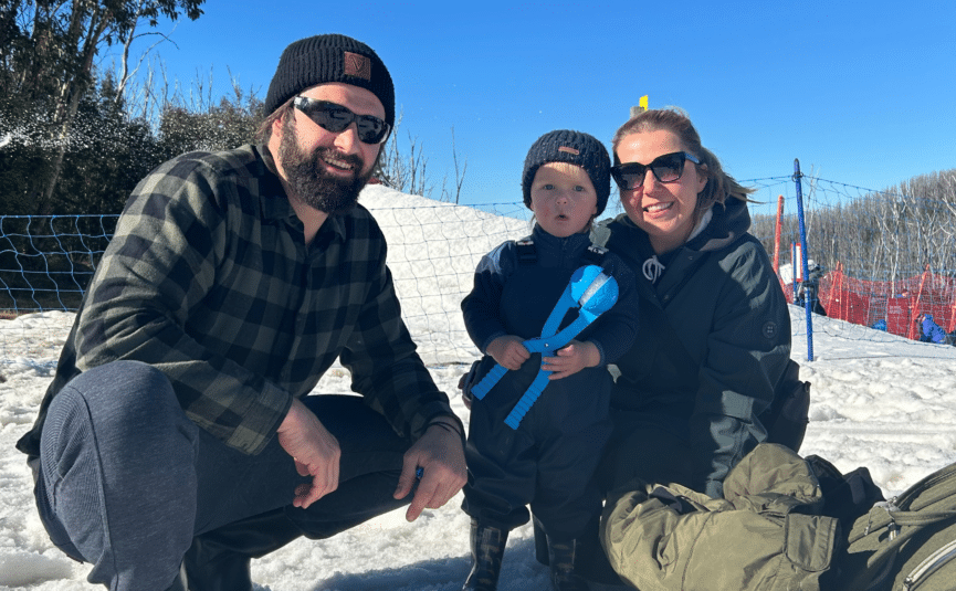 family making snowballs at lake mountain alpine resort