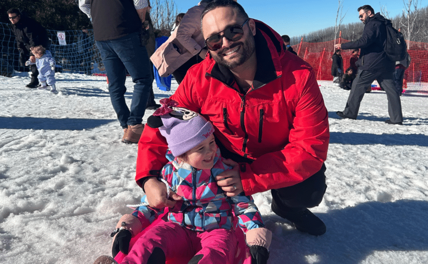 father and daughter in the snow